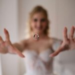 Bride tossing a wedding ring in the air