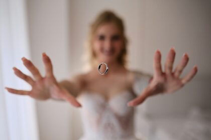 Bride tossing a wedding ring in the air